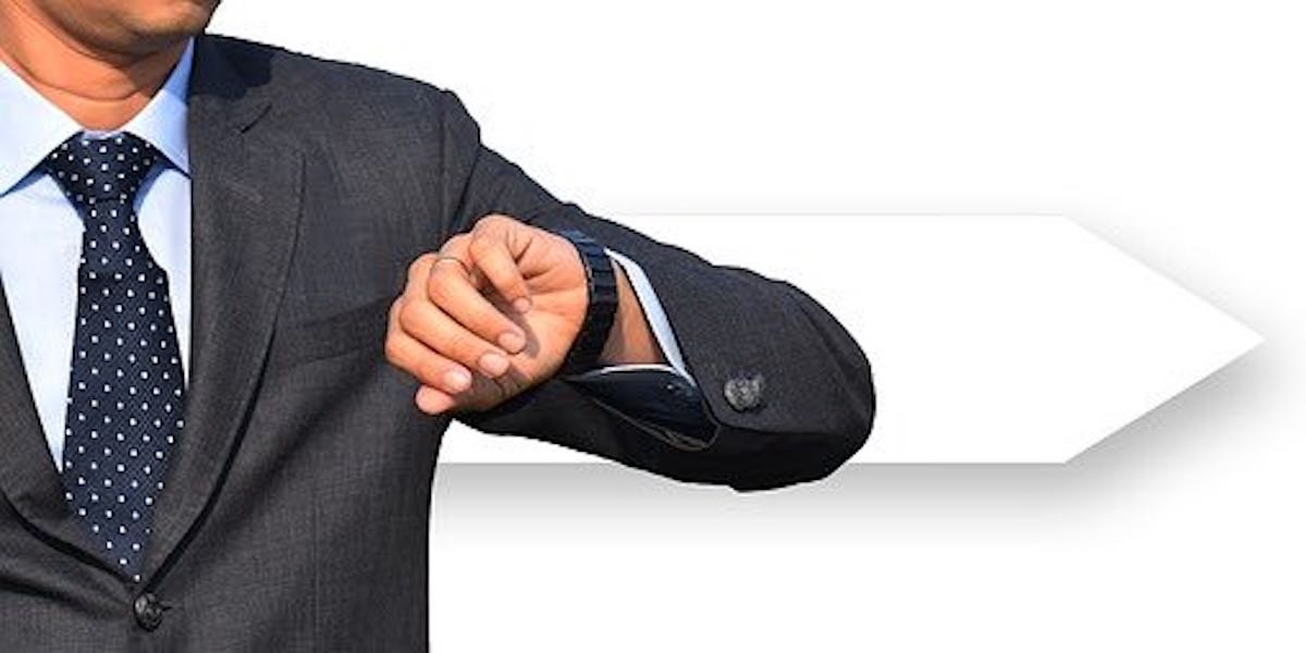 Businessman looking at watch