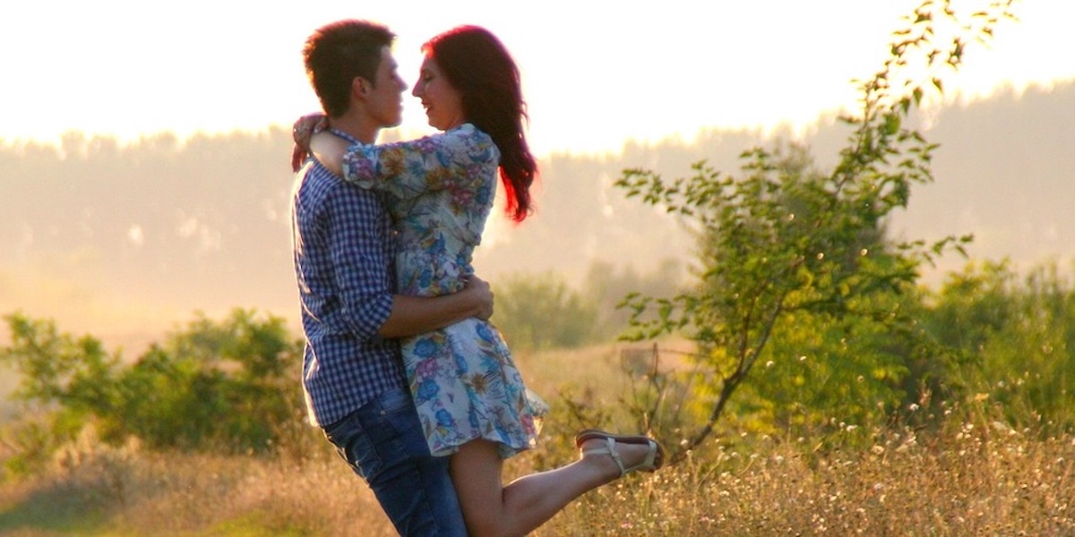 Couple hugging in a nature setting