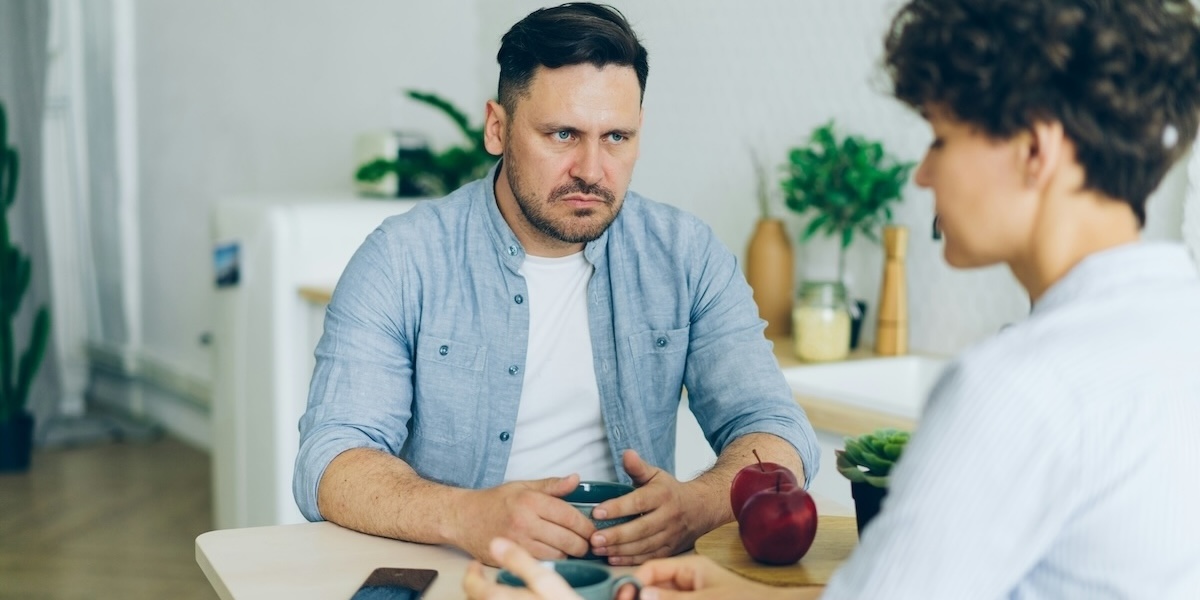 Couple talking looking upset