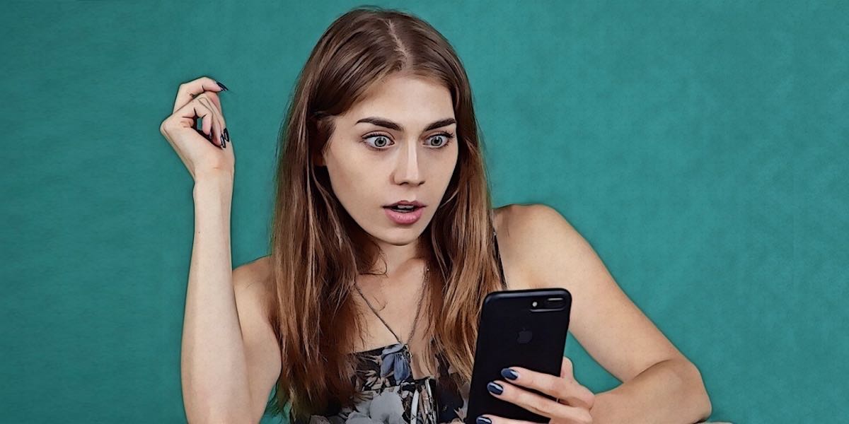 Girl surprised looking at phone