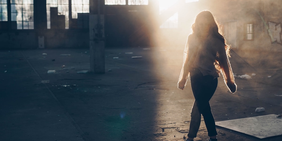 Woman in a vacant warehouse