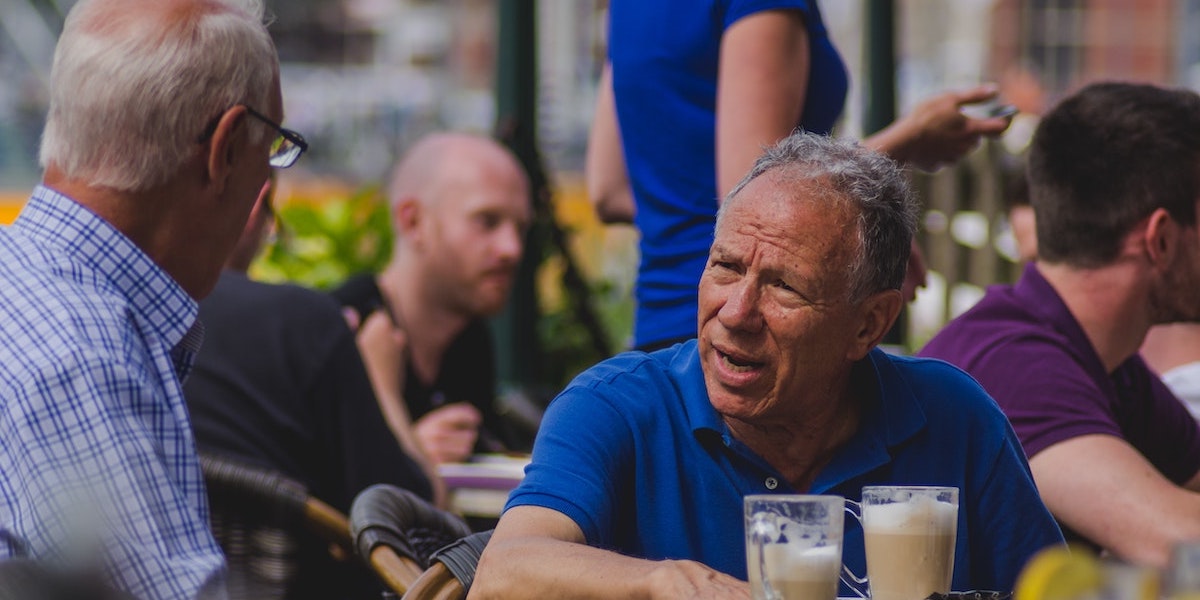 Men discussing the best approach to solve an issue.