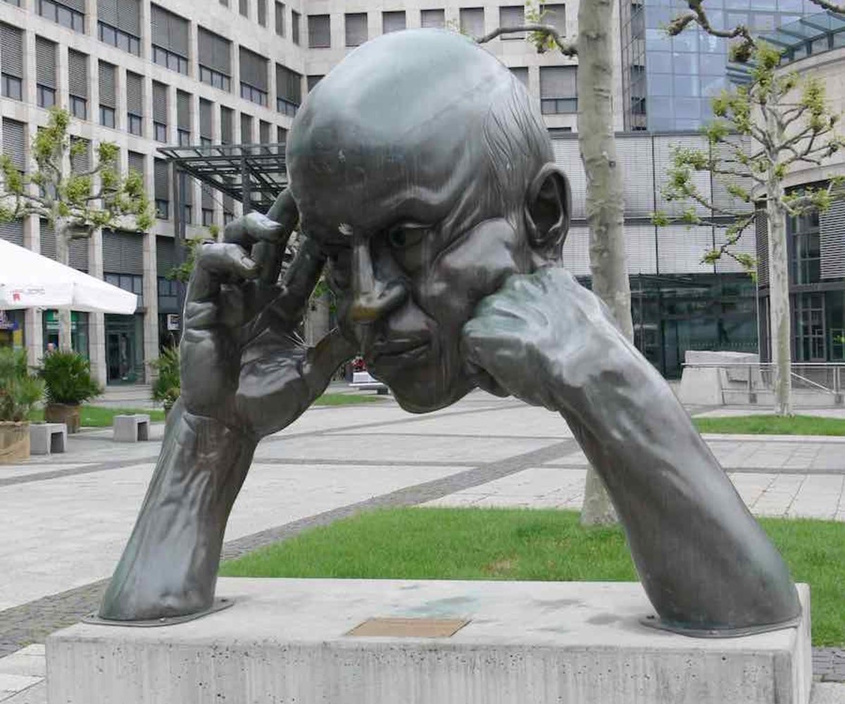 Sculpture of a man in deep thought