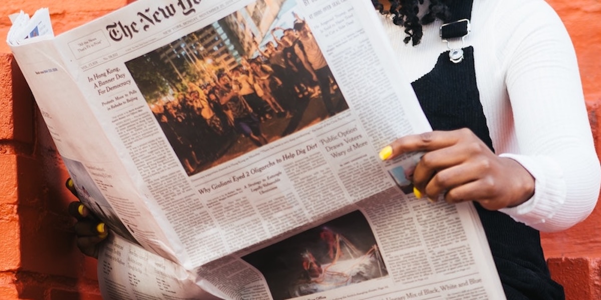 Woman reading a newspaper